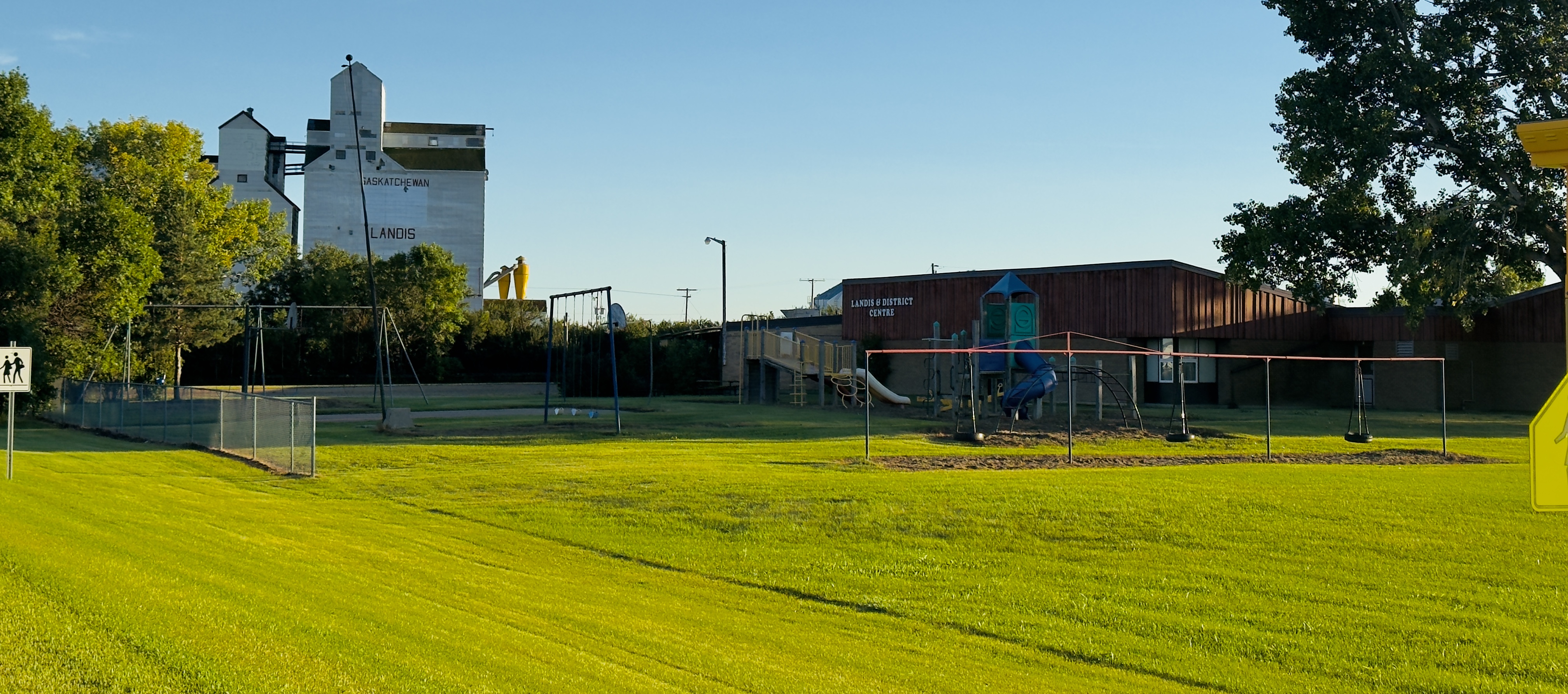 Landis community landscape showing grain elevator, district centre, and green fields